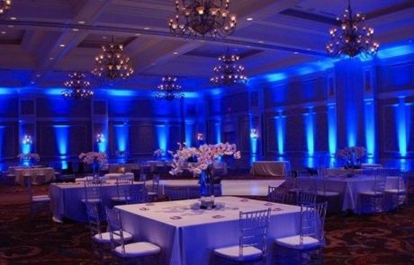 A large ballroom with blue lighting.
