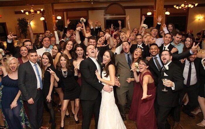 A group of people posing for a photo at a Connecticut wedding reception.